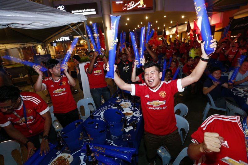 Fans at Tiger FC Big Away Game held at Laundry Bar on May 1 cheer as their favourite club scores.