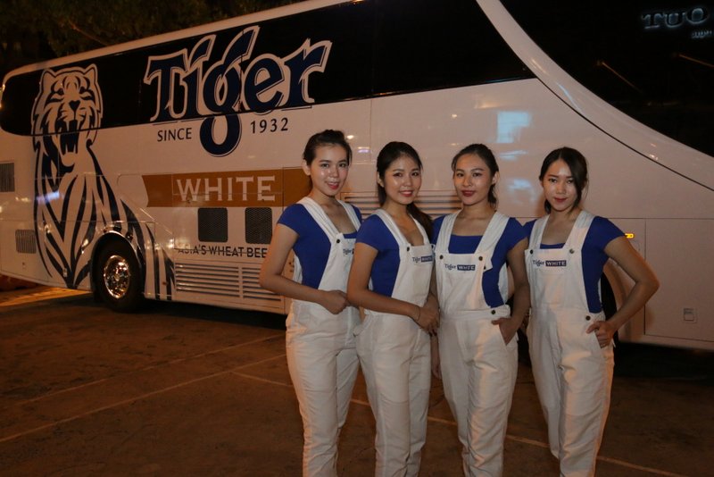 Tiger White brand ambassadors strike a pose before the Tiger White bus