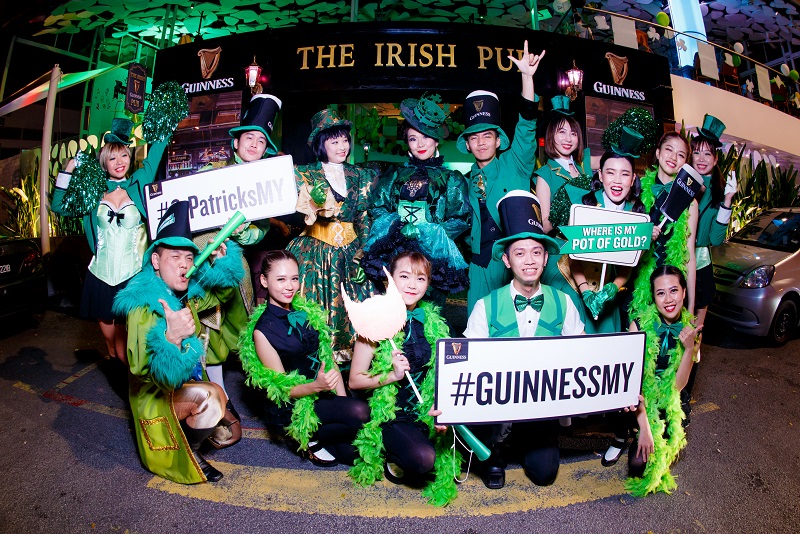 The St Patrick's Parade members pose for a photo outside SOULed Out's 'Irish Pub' facade